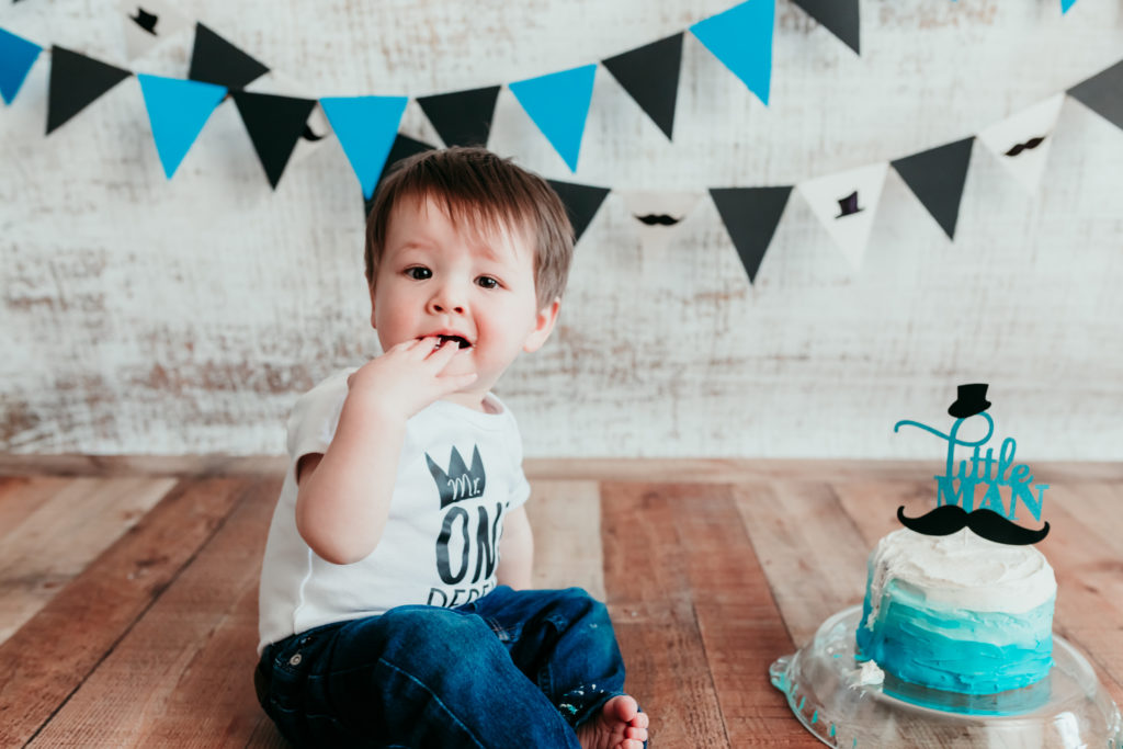 Grayson Cake Smash Photos Valerie Clement Photography in Whitefish, Montana