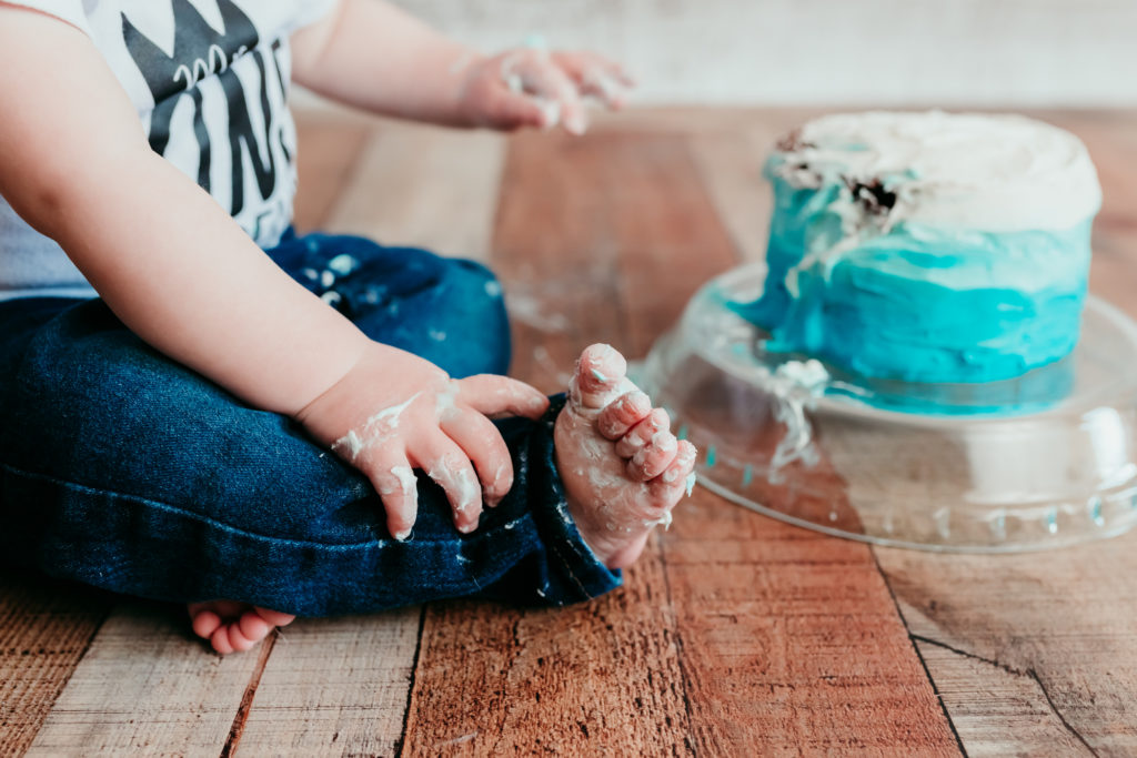 Grayson Cake Smash Photos Valerie Clement Photography in Whitefish, Montana